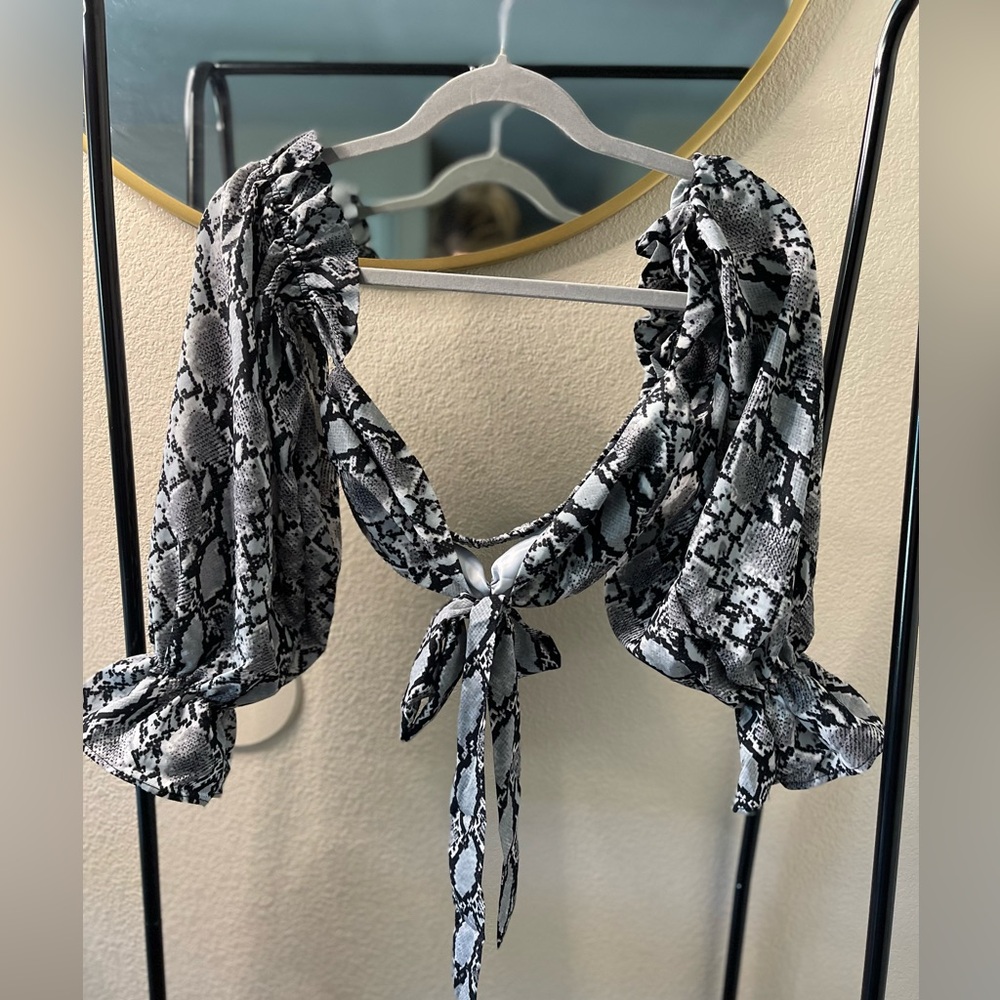 Selling a two-piece snake print set, size 4, only worn once.